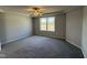Spacious main bedroom with gray carpet and ceiling fan at 16 Shiloh Dr, Lillington, NC 27546