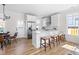 Modern white kitchen with stainless steel appliances and island at 208 W Maynard Ave, Durham, NC 27704