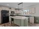 Modern kitchen with island and stainless steel appliances at 261 Willifords Pt Dr, Roxboro, NC 27574