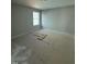 Bright bedroom with a large window providing natural light and a comfortable space at 2405 Englemann Dr # 121, Apex, NC 27502