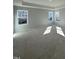 Bright bedroom with multiple windows offering views of the surrounding neighborhood at 2405 Englemann Dr # 121, Apex, NC 27502
