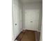 Hallway featuring multiple closets, offering ample storage solutions for an organized home at 2405 Englemann Dr # 121, Apex, NC 27502
