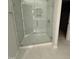Modern bathroom featuring a glass-enclosed shower with white marble tile and stylish fixtures at 2405 Englemann Dr # 121, Apex, NC 27502