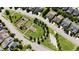Aerial view showcasing the community garden and picnic area with lush green spaces and trees at 241 Serenity Hill Cir, Chapel Hill, NC 27516