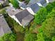 Aerial view of the home and its spacious, landscaped backyard and mature trees at 241 Serenity Hill Cir, Chapel Hill, NC 27516