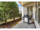 A view of the backyard and patio, which includes a grill at 241 Serenity Hill Cir, Chapel Hill, NC 27516