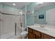 Bright bathroom featuring a glass enclosed shower with built-in seat and a wooden vanity at 241 Serenity Hill Cir, Chapel Hill, NC 27516