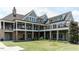 Outdoor veranda overlooking community area with stone columns and second-floor balconies at 241 Serenity Hill Cir, Chapel Hill, NC 27516