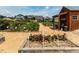 Exterior view of community garden with shed and individual plots, surrounded by houses at 241 Serenity Hill Cir, Chapel Hill, NC 27516