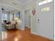 Bright foyer features hardwood floors, a decorative door, and an inviting entrance into the living space at 241 Serenity Hill Cir, Chapel Hill, NC 27516