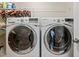 Efficient laundry room with modern washer and dryer units for convenient chores at 241 Serenity Hill Cir, Chapel Hill, NC 27516