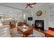 Open concept living room with fireplace that opens to the dining room and kitchen at 241 Serenity Hill Cir, Chapel Hill, NC 27516