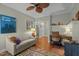 Comfortable living room area with a sofa and view into the entry way with hardwood floors and artwork at 241 Serenity Hill Cir, Chapel Hill, NC 27516