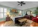 Spacious main bedroom featuring a trey ceiling, ceiling fan, hardwood floors, and plenty of natural light at 241 Serenity Hill Cir, Chapel Hill, NC 27516