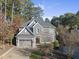 Two-story house with gray siding, a large driveway, and a landscaped lawn at 2500 Shadow Hills Ct Ct, Raleigh, NC 27612