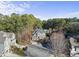 Aerial view of house, neighborhood, and surrounding treeline at 2500 Shadow Hills Ct Ct, Raleigh, NC 27612