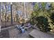 Fire pit and seating area in a wooded backyard at 2500 Shadow Hills Ct Ct, Raleigh, NC 27612