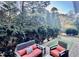 Relaxing backyard patio with seating and artificial turf at 2500 Shadow Hills Ct Ct, Raleigh, NC 27612
