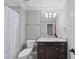 Clean bathroom with white toilet and granite vanity at 2500 Shadow Hills Ct Ct, Raleigh, NC 27612