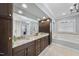 Luxurious bathroom with double vanity and a large soaking tub at 2500 Shadow Hills Ct Ct, Raleigh, NC 27612