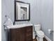 Modern bathroom with dark brown vanity and toilet at 2500 Shadow Hills Ct Ct, Raleigh, NC 27612
