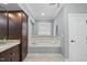 Elegant bathroom with soaking tub, granite vanity, and separate shower at 2500 Shadow Hills Ct Ct, Raleigh, NC 27612