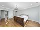 Spacious bedroom with hardwood floors and a large bed at 2500 Shadow Hills Ct Ct, Raleigh, NC 27612