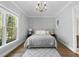 Light-filled bedroom with a queen-size bed and large windows at 2500 Shadow Hills Ct Ct, Raleigh, NC 27612
