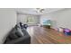 Bright bonus room featuring hardwood floors and large TV at 2500 Shadow Hills Ct Ct, Raleigh, NC 27612
