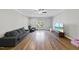 Bright bonus room featuring hardwood floors and large TV at 2500 Shadow Hills Ct Ct, Raleigh, NC 27612