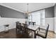 Formal dining room with chandelier, hardwood floors, and large table at 2500 Shadow Hills Ct Ct, Raleigh, NC 27612