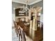 Formal dining room with chandelier, hardwood floors, and large table at 2500 Shadow Hills Ct Ct, Raleigh, NC 27612