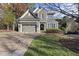Two-story house with gray siding, a large driveway, and a landscaped lawn at 2500 Shadow Hills Ct Ct, Raleigh, NC 27612