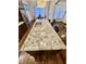 Large kitchen island with granite countertop and double sink at 2500 Shadow Hills Ct Ct, Raleigh, NC 27612