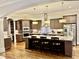 Modern kitchen with granite island, ample cabinetry, and stainless steel appliances at 2500 Shadow Hills Ct Ct, Raleigh, NC 27612