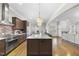 Spacious kitchen boasts granite countertops, stainless steel appliances, and hardwood floors at 2500 Shadow Hills Ct Ct, Raleigh, NC 27612