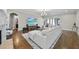 Living room with hardwood floors, a large sectional sofa, fireplace and a view to the entryway at 2500 Shadow Hills Ct Ct, Raleigh, NC 27612