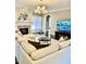 Spacious living room featuring a large sectional sofa, a fireplace, and a large TV at 2500 Shadow Hills Ct Ct, Raleigh, NC 27612
