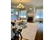 Living room with hardwood floors, a large sectional sofa, a fireplace, and a large TV at 2500 Shadow Hills Ct Ct, Raleigh, NC 27612