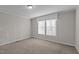 Simple bedroom with neutral colored walls and carpeted floors at 261 Willifords Pt Dr, Roxboro, NC 27574