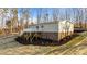 Elevated home with a deck and views of wooded area at 261 Willifords Pt Dr, Roxboro, NC 27574