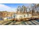 Lakefront home with a brick foundation and covered porch at 261 Willifords Pt Dr, Roxboro, NC 27574