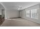 Spacious living room featuring neutral walls and carpeted floors at 261 Willifords Pt Dr, Roxboro, NC 27574