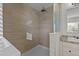 Walk-in shower with neutral tile and glass enclosure at 261 Willifords Pt Dr, Roxboro, NC 27574