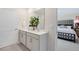 Double vanity bathroom with a large mirror and shower at 263 Hanging Elm Ln, Fuquay Varina, NC 27526