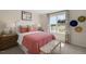 Cozy bedroom with a queen bed and colorful decor at 263 Hanging Elm Ln, Fuquay Varina, NC 27526