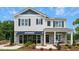 Two-story home with stone accents and a front porch at 263 Hanging Elm Ln, Fuquay Varina, NC 27526