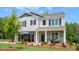Two-story home with stone accents and a front porch at 263 Hanging Elm Ln, Fuquay Varina, NC 27526