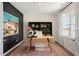 Home office with a large desk, built-in shelving, and a window at 263 Hanging Elm Ln, Fuquay Varina, NC 27526