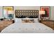 Main bedroom with a king-size bed and stylish headboard at 263 Hanging Elm Ln, Fuquay Varina, NC 27526
